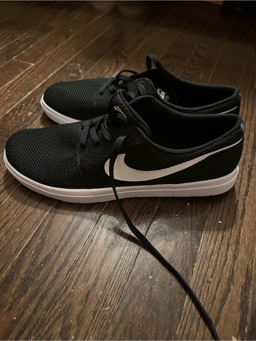 Nike Black Mesh Athletic Sneakers with White Swoosh